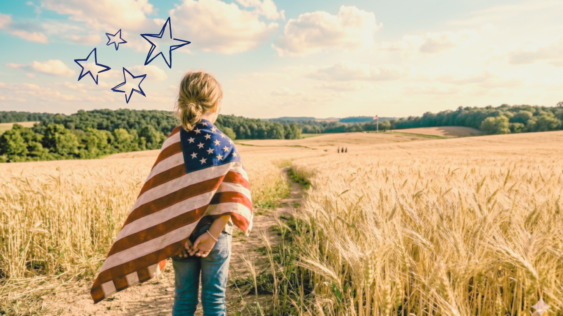 A child draped in an american flag looks out over a field of wheat